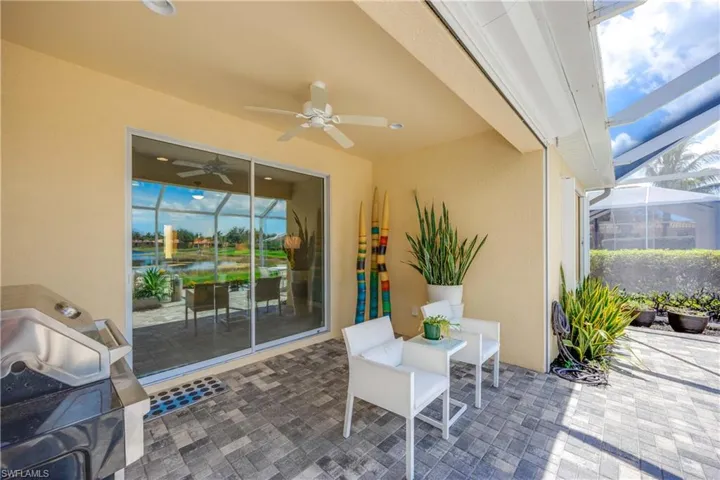 Spacious lanai with potted plants and artwork
