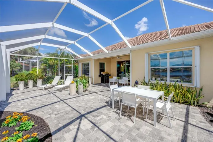 View of patio / terrace with area for grilling and glass enclosure