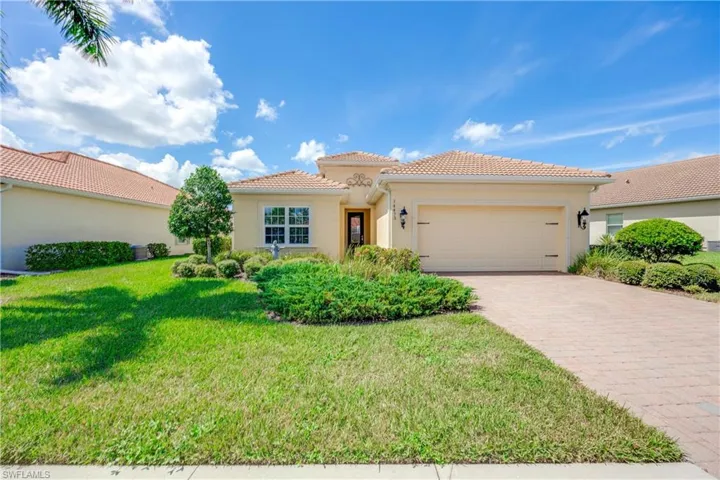 Lovely home with a double-car garage and a front lawn