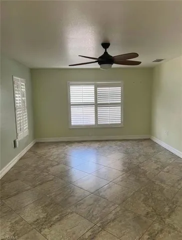 View of swimming pool featuring a patio area, a fenced backyard, outdoor dining space, a pool with connected hot tub, and a storage unit