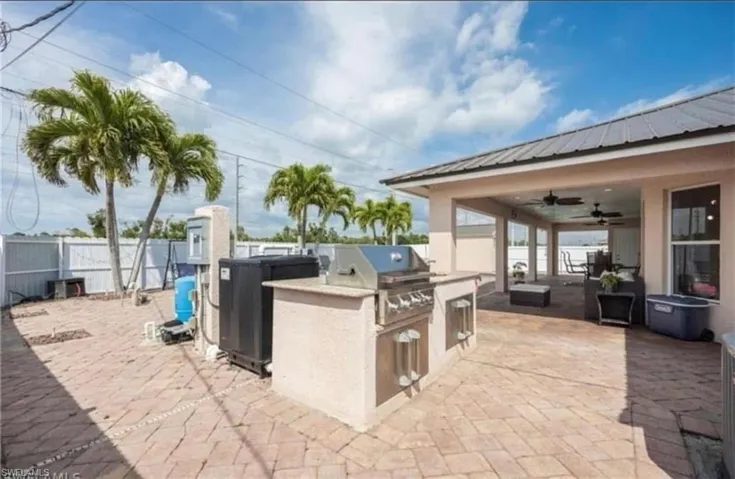 View of swimming pool with a patio, a fenced backyard, and a pool with connected hot tub