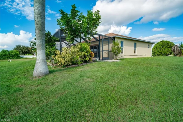 View of yard featuring a lanai