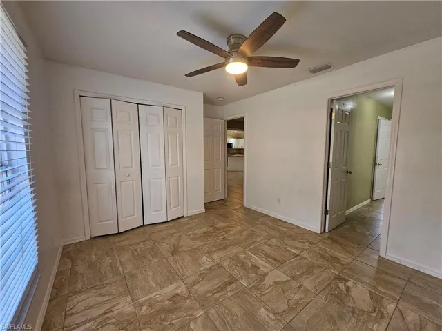 Neutral-toned tile flooring throughout the space
