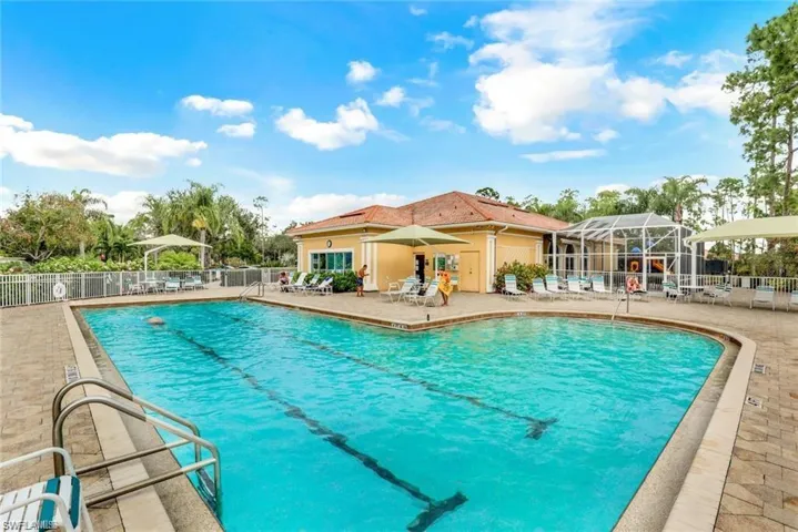 Community pool with a patio area