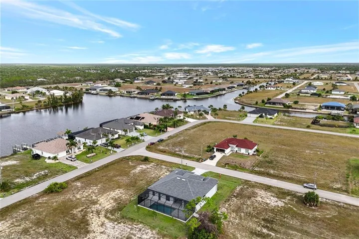 Aerial view of residential area with a nearby body of water