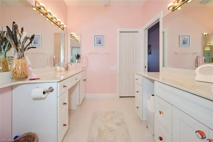 Bathroom featuring tile patterned flooring and vanity