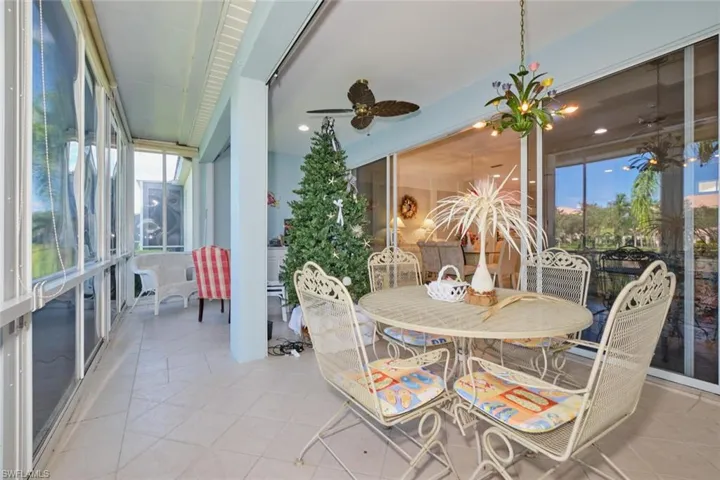 Sunroom featuring ceiling fan