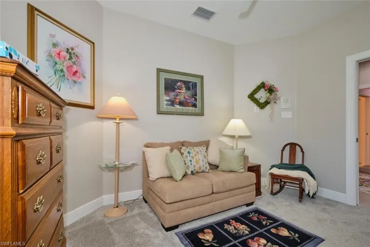 Sitting room with light colored carpet