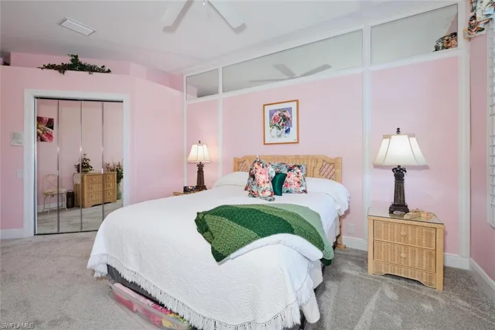 Bedroom with carpet floors, ceiling fan, and a closet