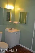 Bathroom featuring vanity and toilet