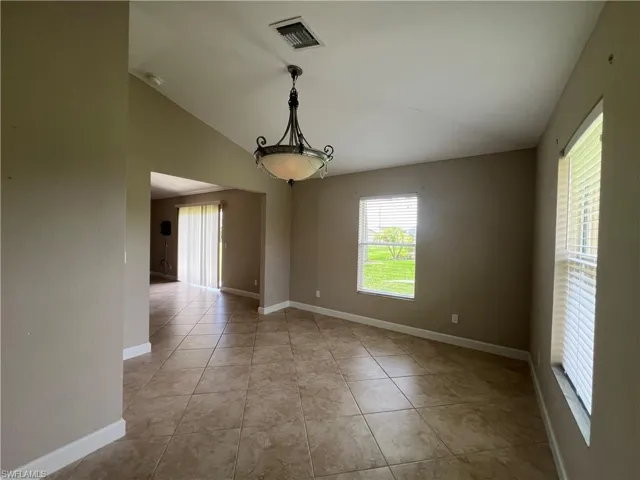 Large den opens onto living area.