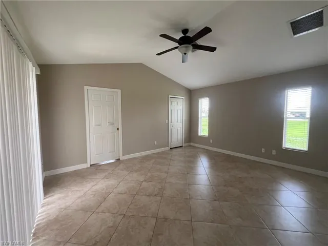 Large Master bedroom has LOTS of natural light with 2 windows on back yard side and sliders on pool side.
