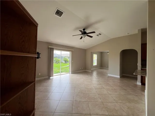 Another angle showing living room opening up to den and to hallway leading to guest bedroom en-suite wing.
