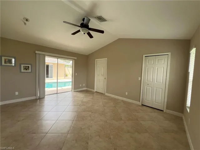 Large master bedrom has sliders that open onto beautiful pool area.