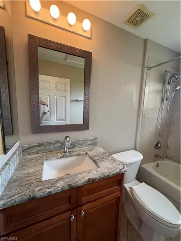 Guest ensuite bathroom with vanity granite counter.
