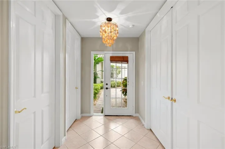 Entryway featuring a chandelier and tile patterned floors