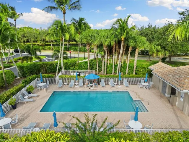 Community pool featuring a patio