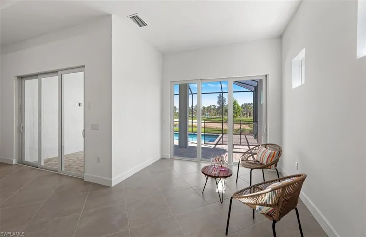 Sitting room with tile flooring
