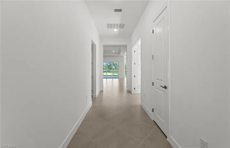 Hall with tile flooring