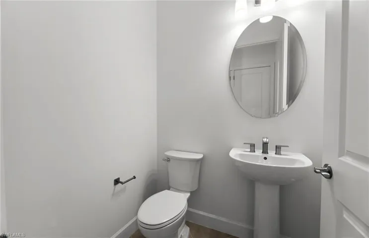 Bathroom featuring toilet and hardwood / wood-style floors