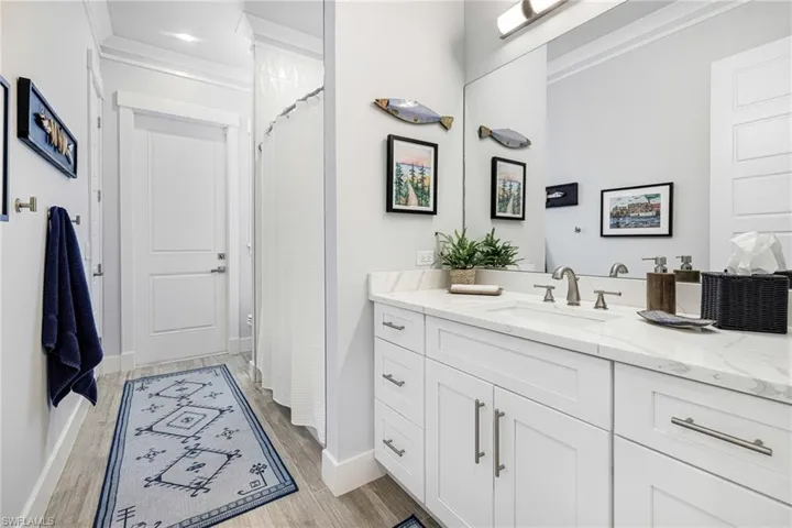 Cabana bathroom (toilet, tub/shower, and vanity) connected to pool deck