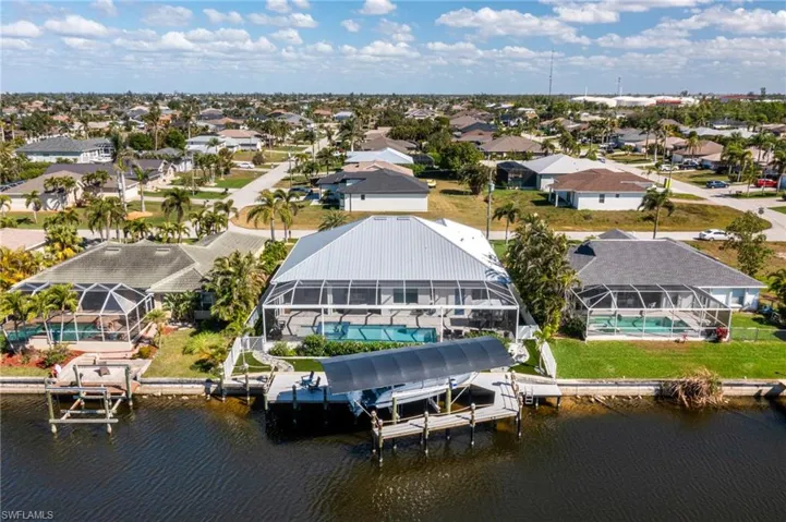 Aerial view with a water view and a residential view