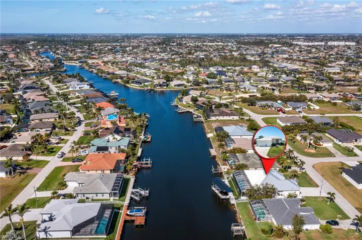 Drone / aerial view featuring a water view and a residential view