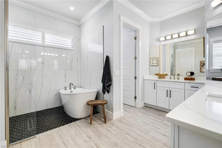 Primary bathroom - soaker tub, walk in shower, and dual vanities