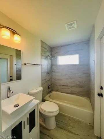 Full bathroom with  shower combination and vanity