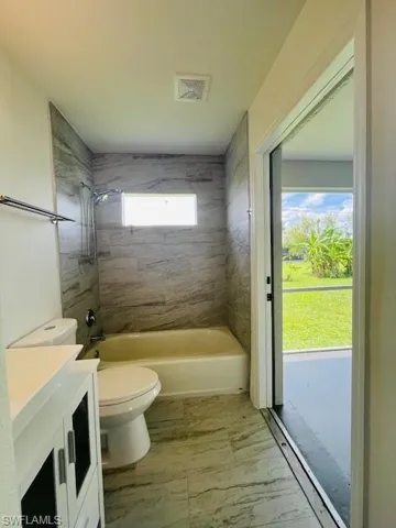 Full bath with  shower combination and vanity