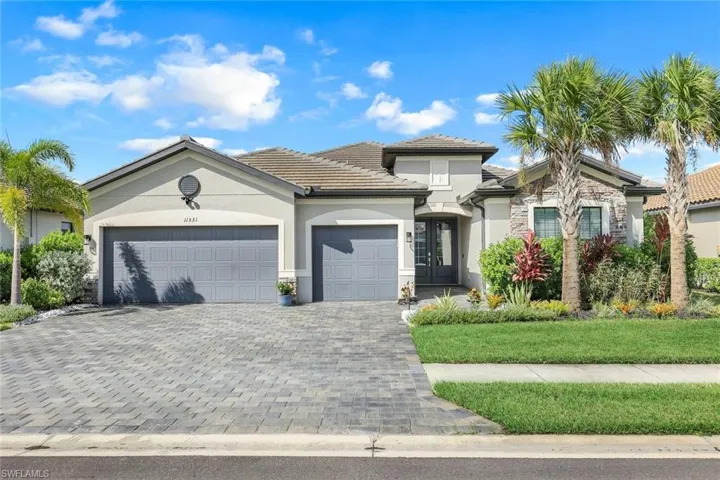 View of front of property featuring a garage