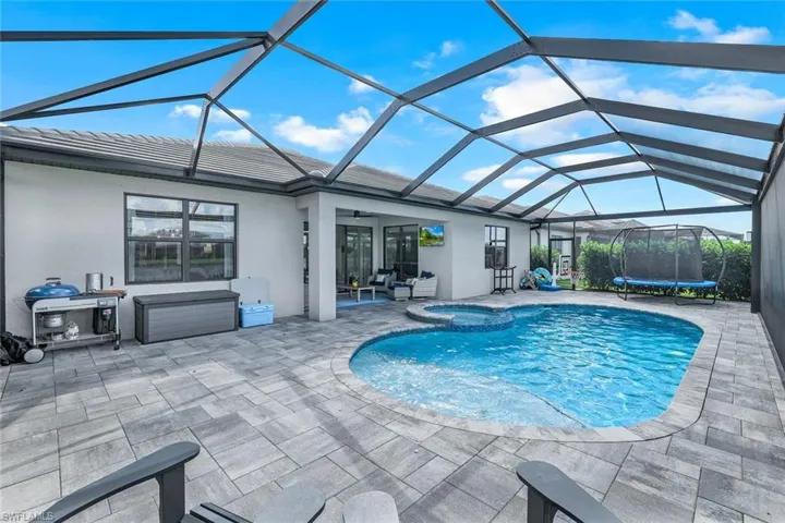 View of pool featuring a lanai and a patio area