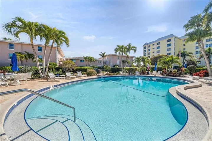 Community pool with a patio