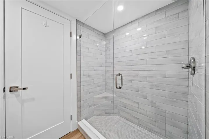 Full  bathroom with a stall shower and recessed lighting