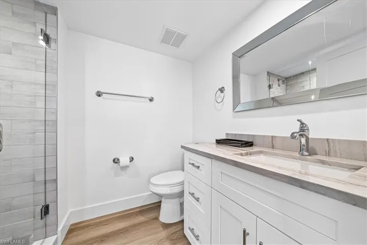 Full  bathroom with a stall shower and recessed lighting
