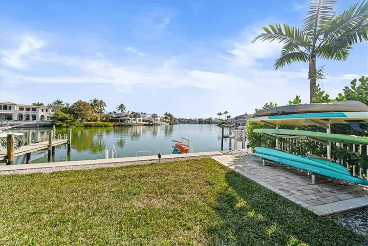 Dock with a yard and a water view