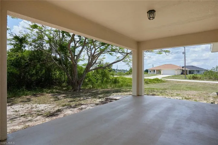 View of patio / terrace featuring a garage
