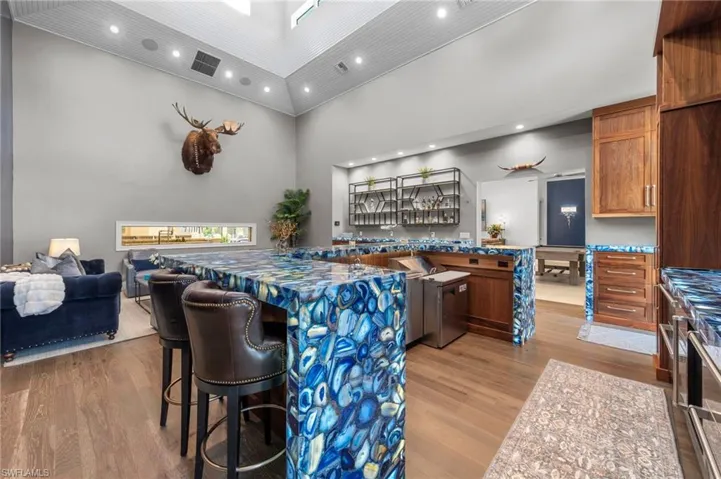 Custom-built bar with exotic, illuminated countertops