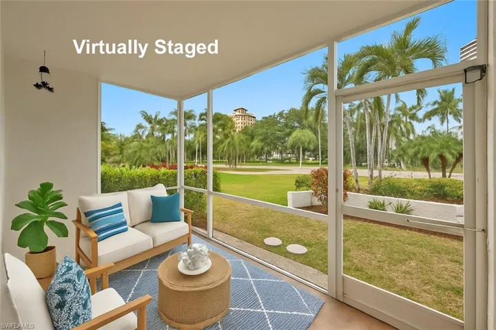 Sunroom / solarium featuring a wall of windows