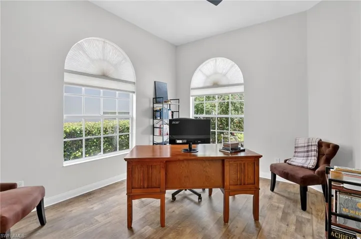 Den/Office featuring wood finished floors and ceiling fan