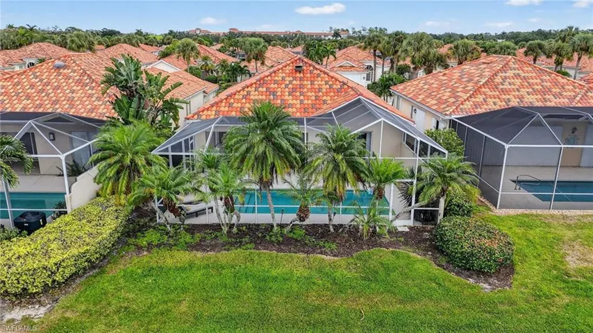 View of backyard and pool enclosure