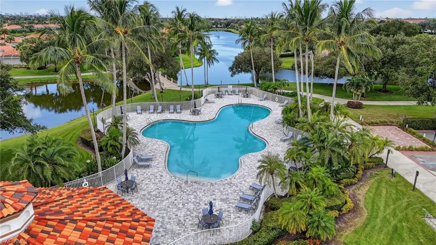 Community pool featuring a water view