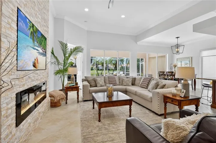 Great room with custom stone wall and electric fireplace