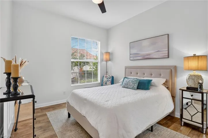 Bedroom with wood finished floors and ceiling fan