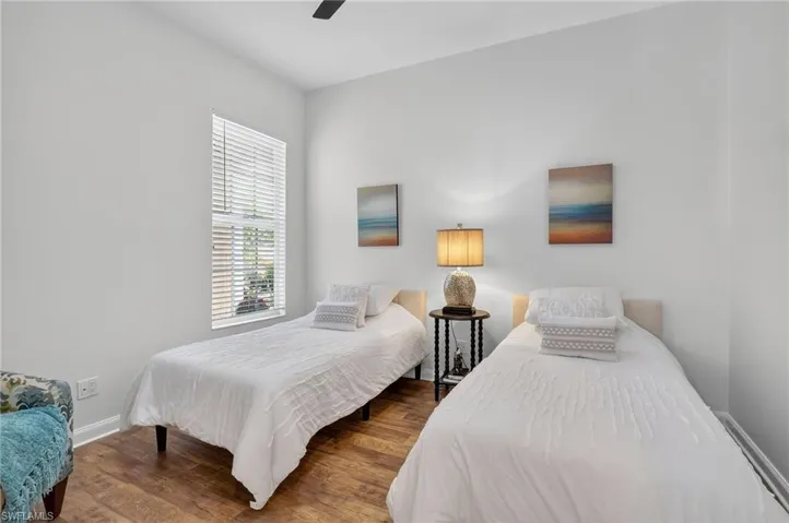 Bedroom with wood finished floors and a ceiling fan