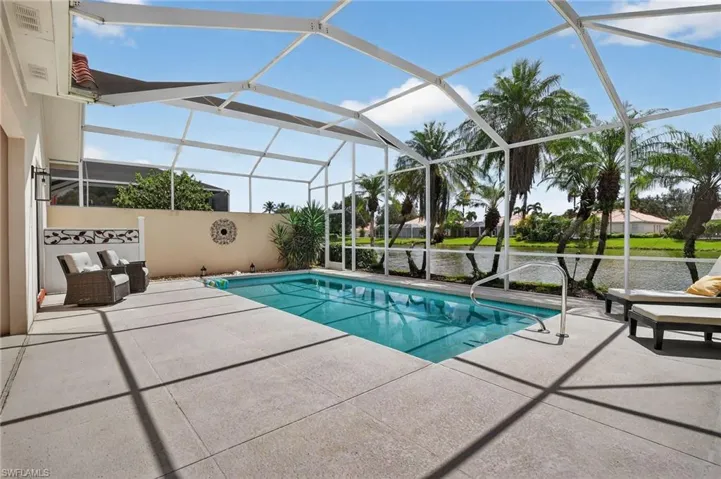 Swimming pool with privacy wall between neighbors