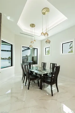 Dining area with a raised ceiling
