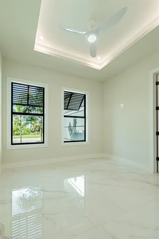 Spare room featuring a raised ceiling