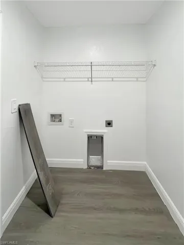 Laundry area featuring electric dryer hookup, washer hookup, and dark wood finished floors