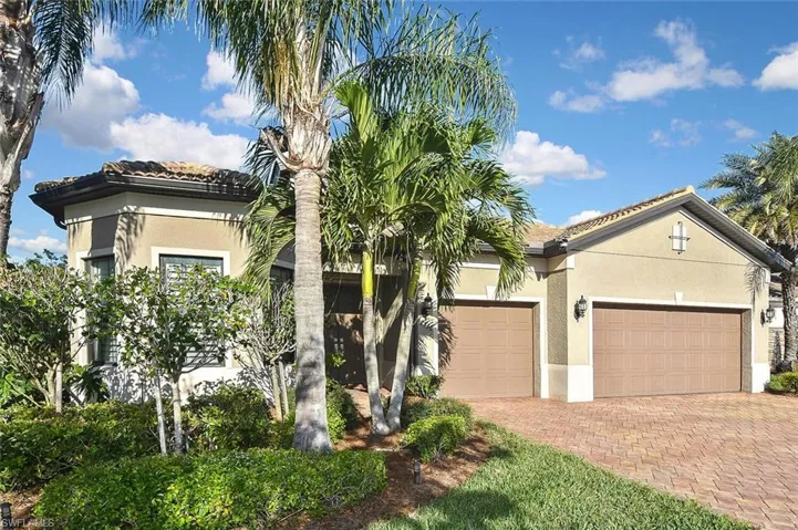 Three car Garage, Tile Roof, and Paver Drive